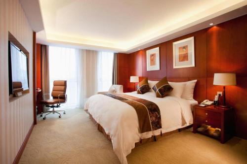 Postel nebo postele na pokoji v ubytování Xian Qujiang Yinzuo Hotel
