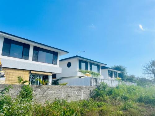 a house on a hill with a retaining wall at Paradise in Lembongan awaits in Nusa Lembongan