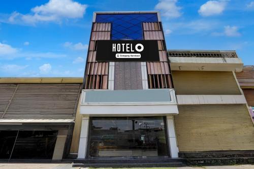 a hotel sign on the side of a building at Super Hotel O Subedarganj Railway Junction Formerly Krishna Inn in Prayagraj