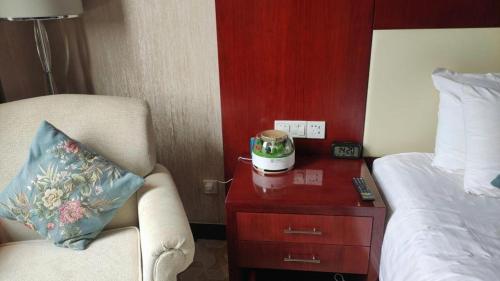 Katil atau katil-katil dalam bilik di New Century Hotel Zaozhuang Fengming