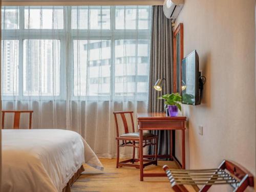 Ένα ή περισσότερα κρεβάτια σε δωμάτιο στο Uniton Hotel Shenzhen