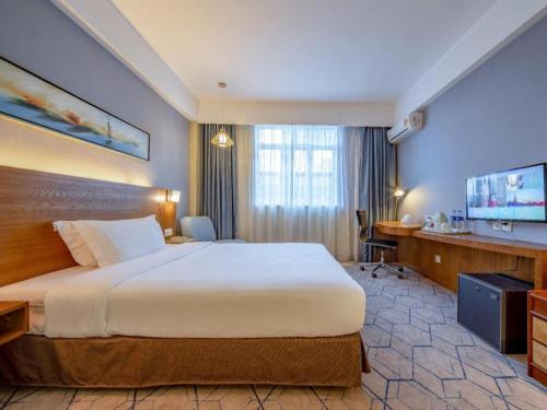 Ένα ή περισσότερα κρεβάτια σε δωμάτιο στο Uniton Hotel Shenzhen