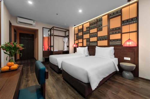 a hotel room with two beds at Lestar Hotel Sapa in Sa Pa