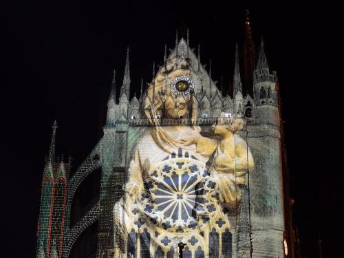 a large building with a clock tower at night at Botanical garden view in Metz in Montigny-lès-Metz
