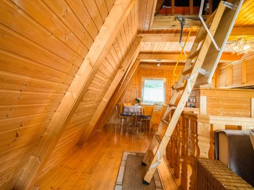 an overhead view of a staircase in a wooden house at Cozy Forest Hideaway in Suhl in Suhl