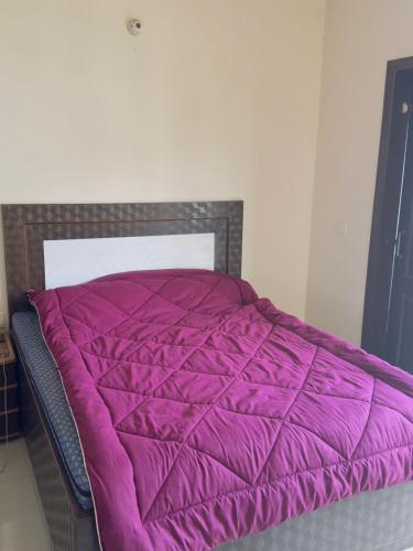 Una cama o camas en una habitación de Omaxe Cassia