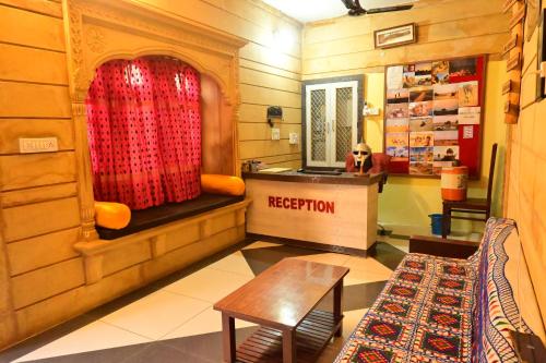 a room with a bench and a table in a store at Relax Inn Jaisalmer in Jaisalmer