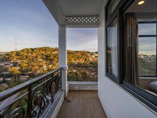 a balcony with a view of a city at Gold View Boutique Hotel Đà Lạt in Da Lat