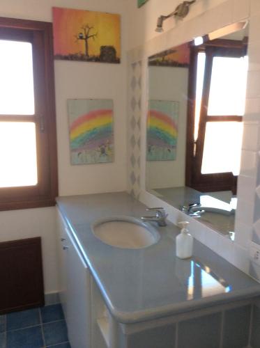 a bathroom with a sink and a mirror at Tiffany Palau in Palau