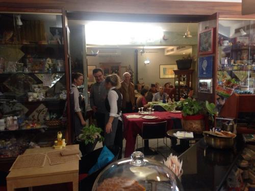 a group of people standing inside of a store at Hotel Letizia in Orte
