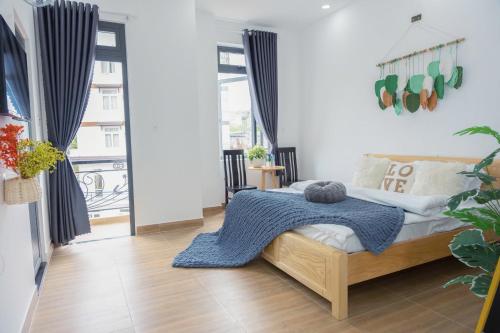 Ένα ή περισσότερα κρεβάτια σε δωμάτιο στο Yori House Da Lat City
