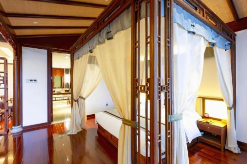 Cama o camas de una habitación en Langfang Ovation Hotel