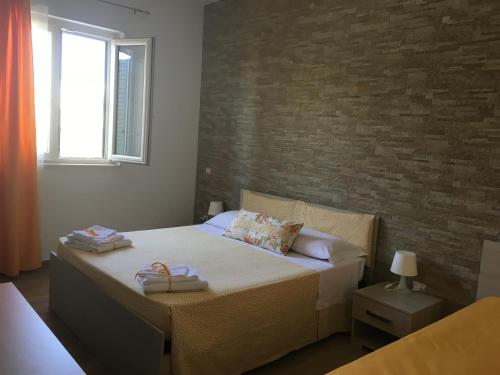Postel nebo postele na pokoji v ubytování Messapia Casa Vacanze