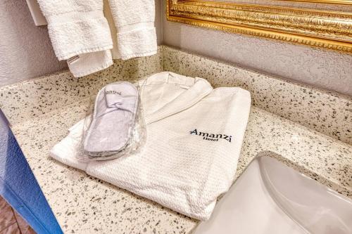 a white towel sitting on top of a bathroom counter at Amanzi Hotel, an Ascend Collection Hotel in Ventura