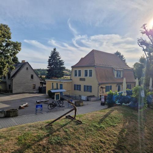 a house with a bike parked in front of it at Ferienwohnung "Kleine Auszeit" in Bad Kösen