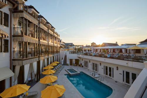 a view of a hotel with a pool and umbrellas at The Pearl Hotel in Rosemary Beach