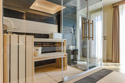 a room with a glass display case in a room at FH55 Grand Hotel Palatino in Rome