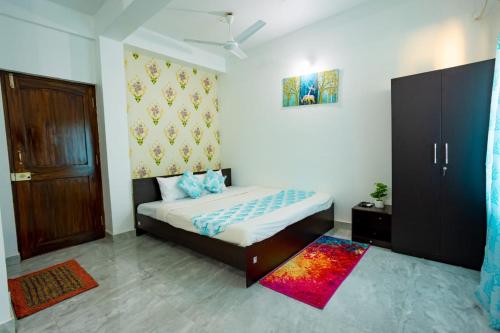 Postel nebo postele na pokoji v ubytování SAYALI HOME STAY Calangute