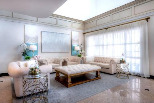 a large living room with couches and a table at The Volare, an Ascend Collection Hotel in San Clemente