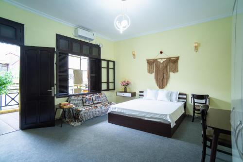 Ένα ή περισσότερα κρεβάτια σε δωμάτιο στο CozyPosy Premier Apartment