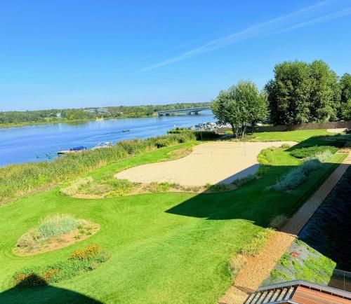 an overhead view of a golf course next to a river at Apartament Premium View w Riva Zegrze, Jezioro Zegrzyńskie in Zegrze Południowe