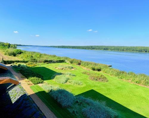 an aerial view of a golf course next to the water at Apartament Premium View w Riva Zegrze, Jezioro Zegrzyńskie in Zegrze Południowe