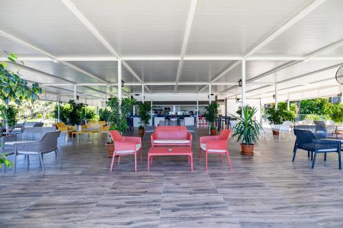 a group of chairs and tables in a restaurant at VONRESORT Elite & Aqua - Ultra All Inclusive & Kids Concept in Side