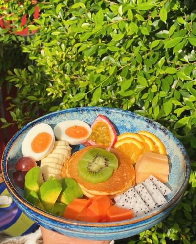 a bowl filled with different types of fruits and vegetables at Chomklong Experience in Pak Chong