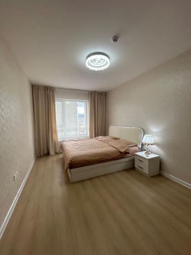 Ένα ή περισσότερα κρεβάτια σε δωμάτιο στο Cosy 2 bedroom apartment