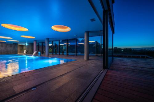 a house with a swimming pool at night with frisbees at Apartament Premium View w Riva Zegrze, Jezioro Zegrzyńskie in Zegrze Południowe