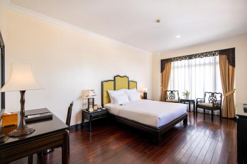 Postel nebo postele na pokoji v ubytování TTC Imperial Hotel
