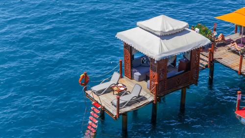 a pier with a lifeguard station in the water at VONRESORT Elite & Aqua - Ultra All Inclusive & Kids Concept in Side