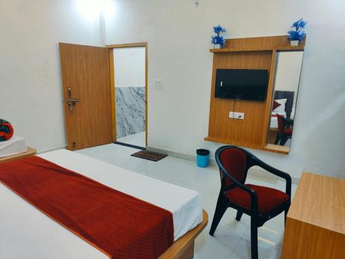 Una televisión o centro de entretenimiento en Hotel Premium Residency