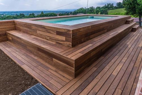 a wooden deck with a swimming pool on top of it at Agriturismo Dai Gobbi in Fara Vicentino