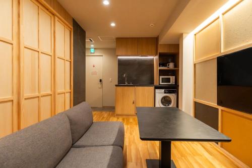 a living room with a couch and a table at winco - Vacation STAY 06660v in Tokyo