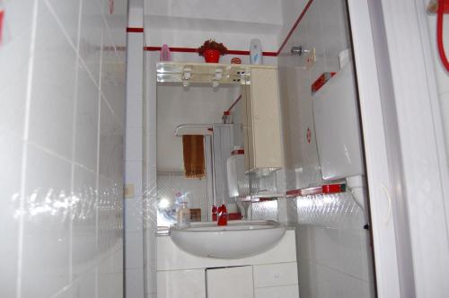 a bathroom with a white sink and a mirror at Casa Unci in Canneto