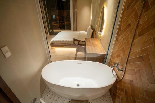 a bathroom with a white sink in a room at UMEE Homestay in Thôn Trường Giang