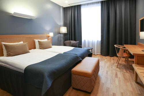 Ένα ή περισσότερα κρεβάτια σε δωμάτιο στο Scandic Tampere City