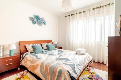 Ένα ή περισσότερα κρεβάτια σε δωμάτιο στο Lagoa Residence