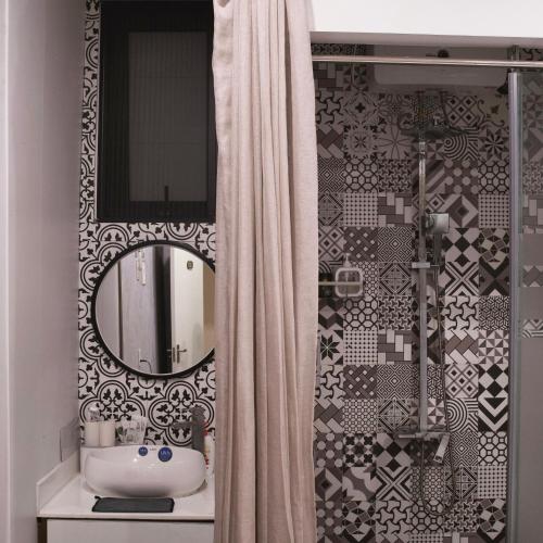 a bathroom with a sink and a mirror at Lacasa Homestay in Hue