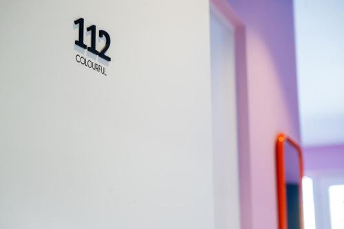 a sign on a door that says degrees at Hotel Skjern in Skjern