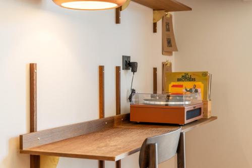 a wooden table with a box on top of it at Hotel Skjern in Skjern