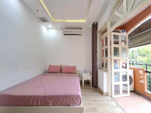 เตียงในห้องที่ Lunaria Maison - Tan Dinh Corner