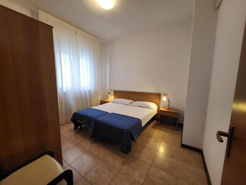 Ένα ή περισσότερα κρεβάτια σε δωμάτιο στο Villa Mazzon Family Apartments