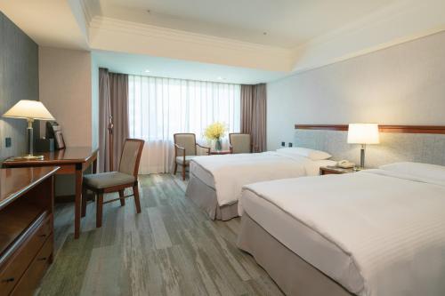 Katil atau katil-katil dalam bilik di Evergreen Laurel Hotel - Taichung
