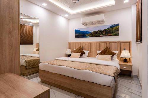 a bedroom with two beds in a room at Urban Oasis in New Delhi