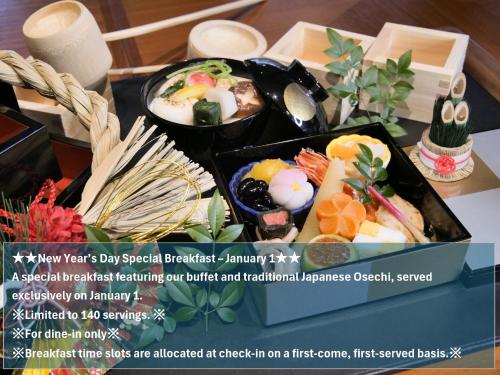 a table with two dishes of food on it at Hotel Trad Hakata in Fukuoka