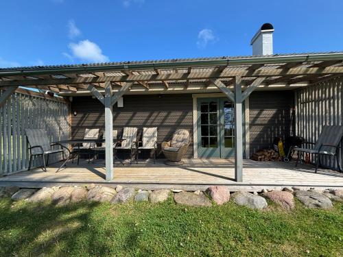 a wooden deck with a table and chairs on it at Matsi Maria Big in Matsi