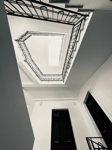 a ceiling in a building with a black door at Residenza Margot Cosenza in Cosenza