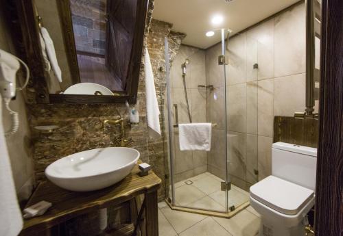 a bathroom with a sink and a shower at Passage Hotel in Baku